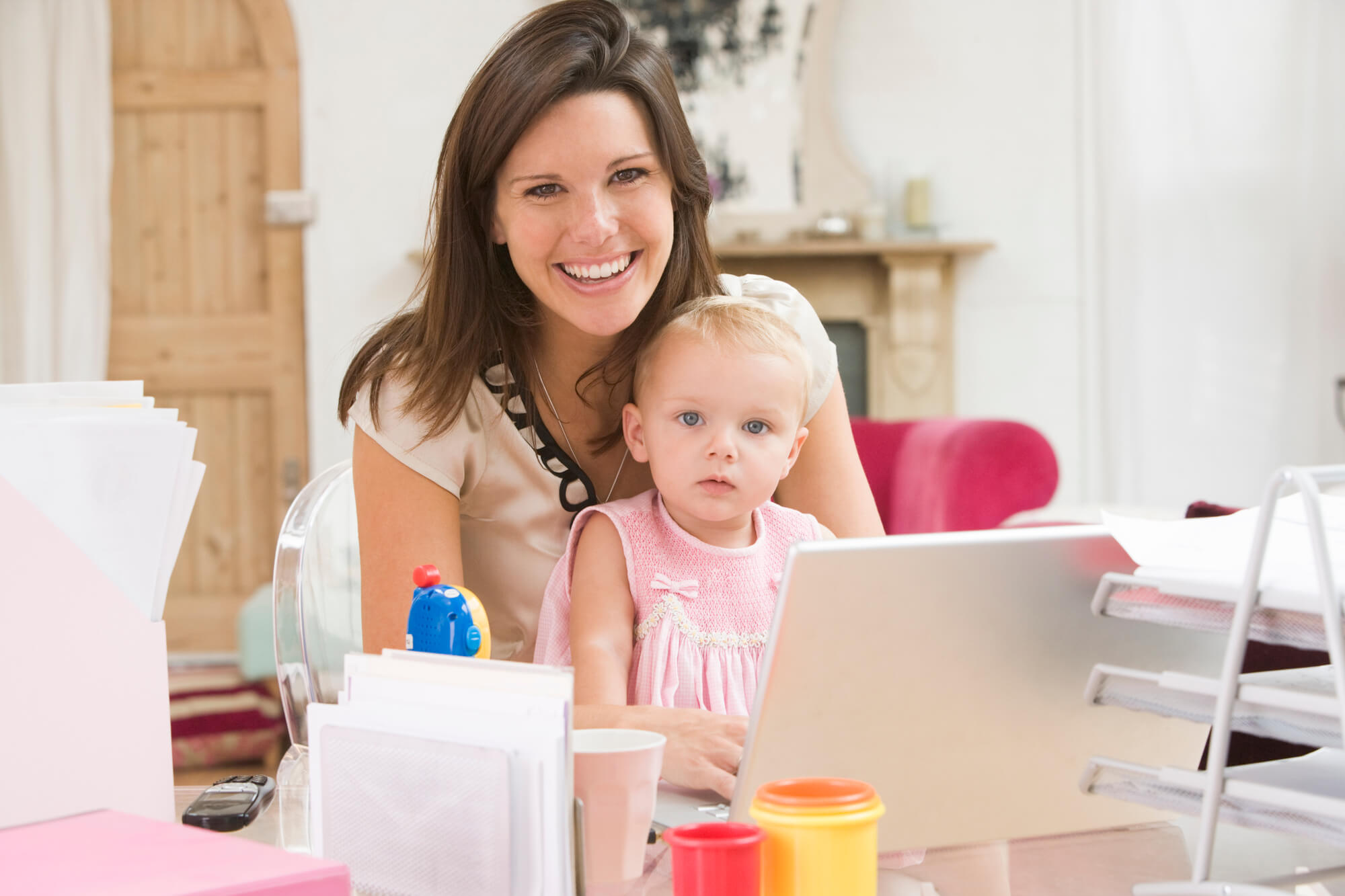 an owner of a Flexible Home Business caring for her baby while at work