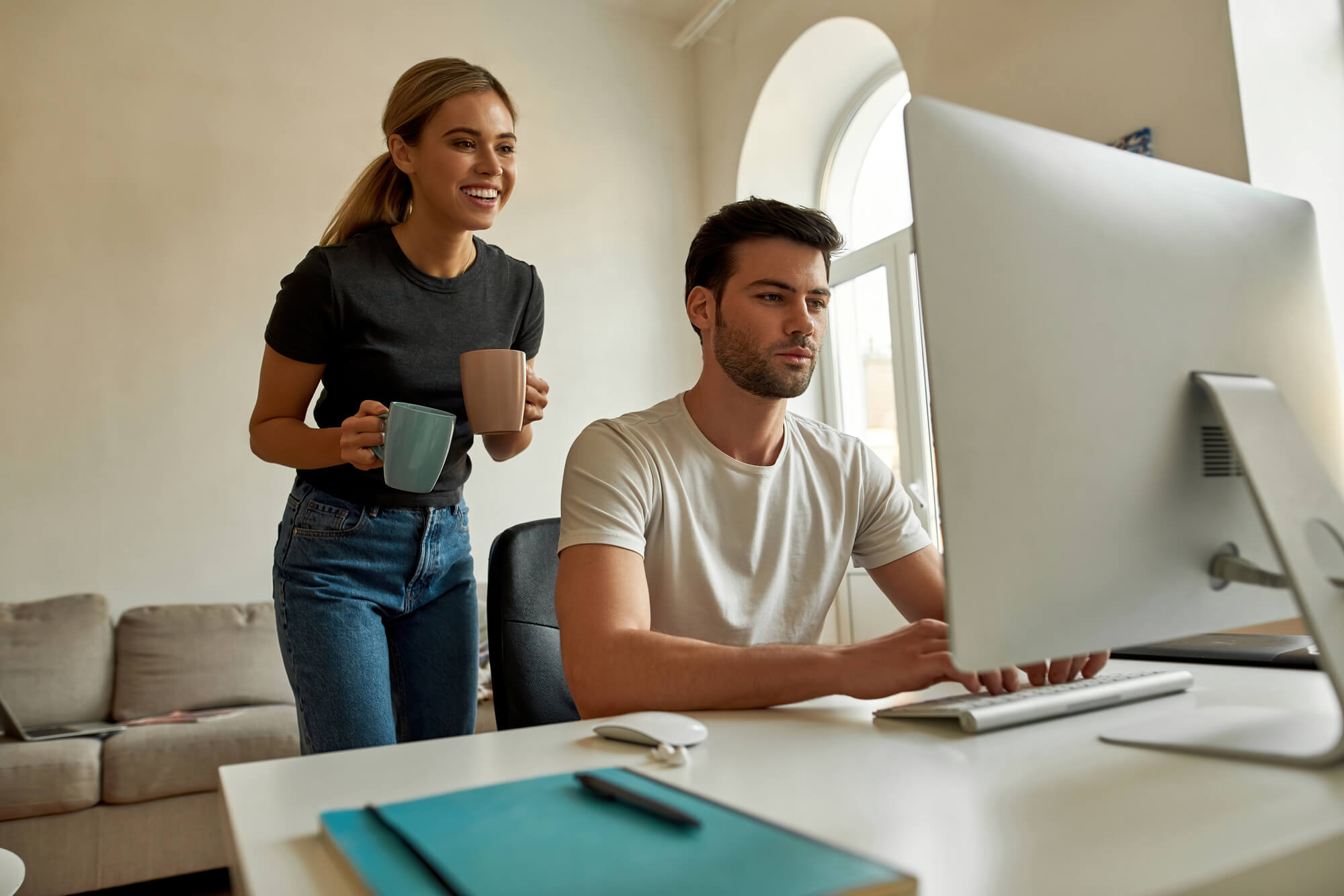 couple searching the computer for Profitable Home Business ideas